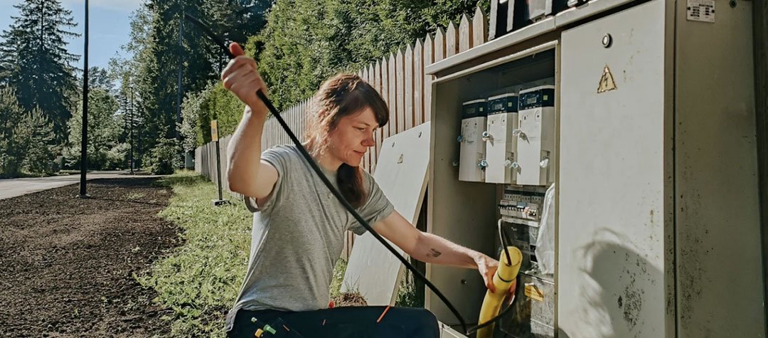 Picture of an electrician making a repair.